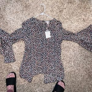 Lauren Conrad dress shirt. Longer in back with a slit. Very cut. New with tags.